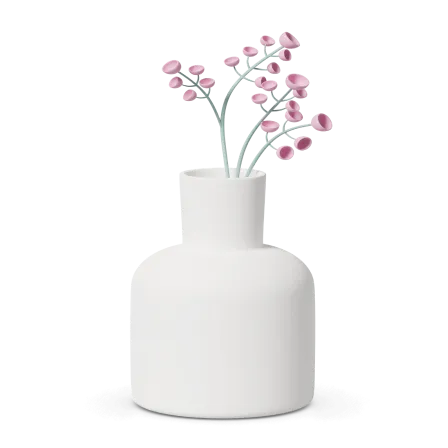 Preserved floral arrangement in a white vase