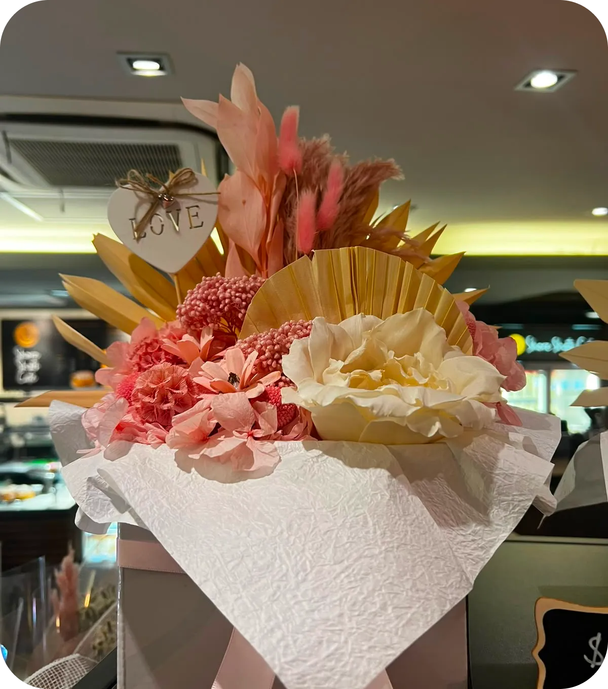 Preserved pink and cream floral arrangement
