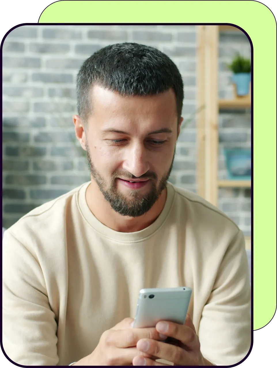 A man updating his details on his phone